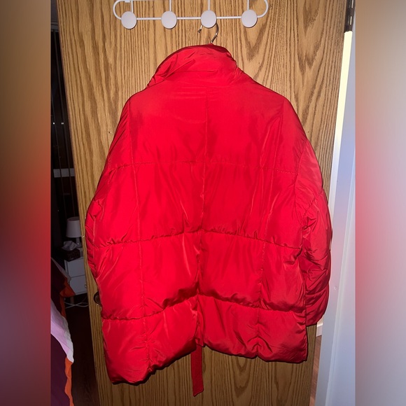 Red puffer jacket with a belt, snaps, and a high collar. The jacket is quilted. - Picture 1 of 4